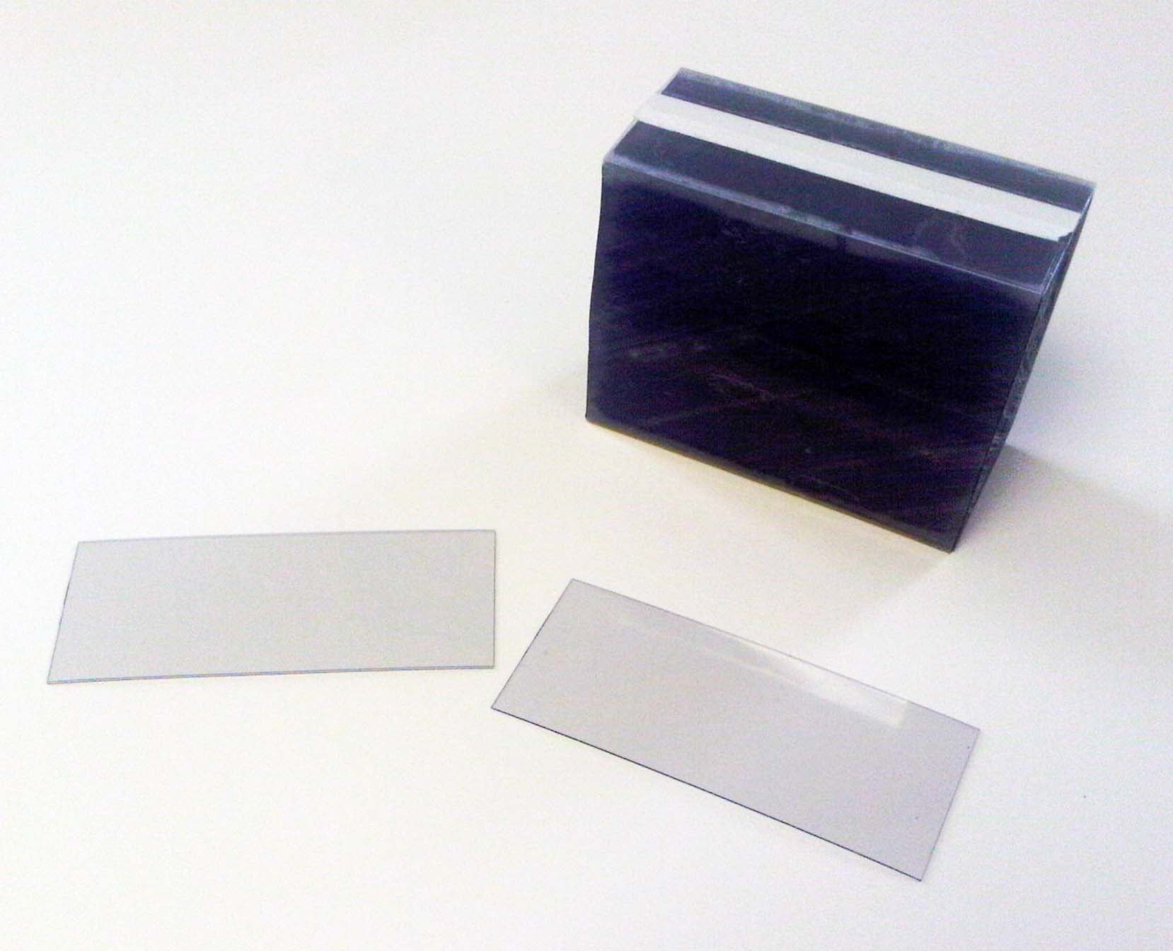 Vestcom 1 1/4" x 2" Clear Shelf Chip, designed to fit standard 1 1/4" shelf channels. 500 pieces, divided into 2 bundles of 250 each, ideal for retail displays.